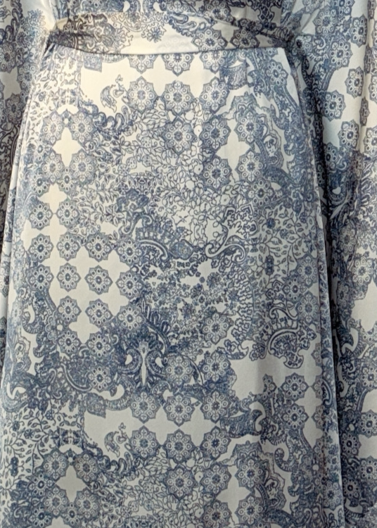 Kaftan dress with floral pattern on a white background